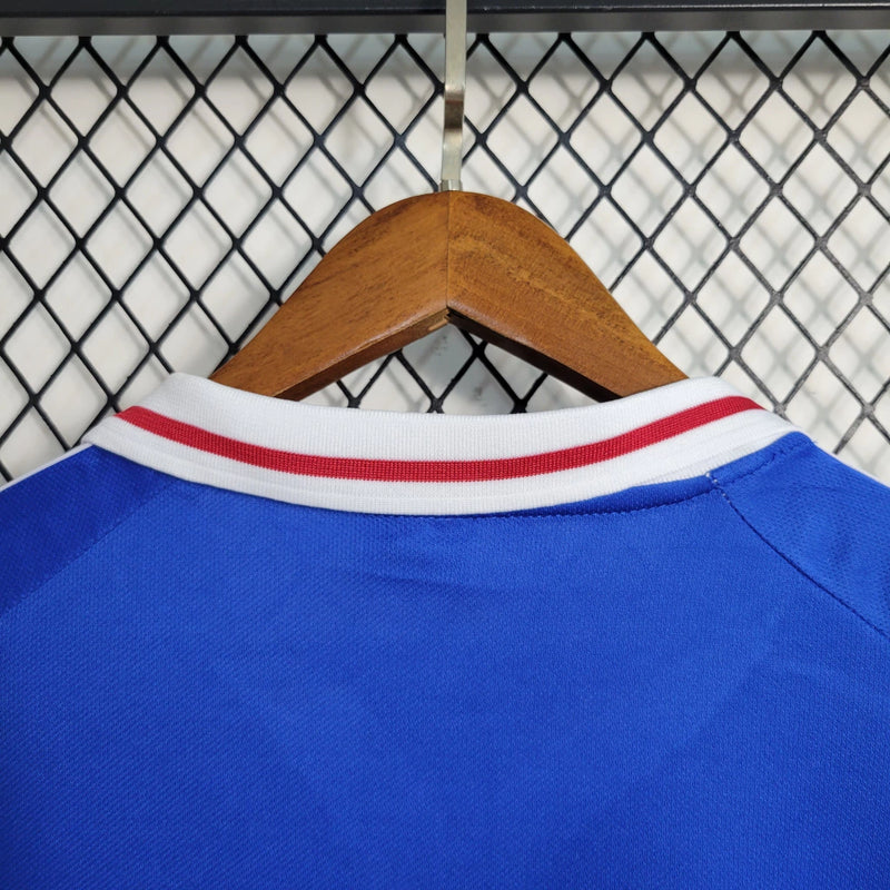Camisa Iugoslávia 2000/01 Adidas retrô masculina azul com detalhes em branco e vermelho, gola polo com botão e mangas curtas, modelo clássico em tecido leve para torcedores e colecionadores"