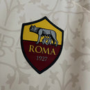 Camisa Roma Away II 2023/24 Adidas Torcedor Masculina bege, com detalhes em grená e dourado, escudo bordado da Roma, logo Adidas e tecido AEROREADY para conforto e respirabilidade.