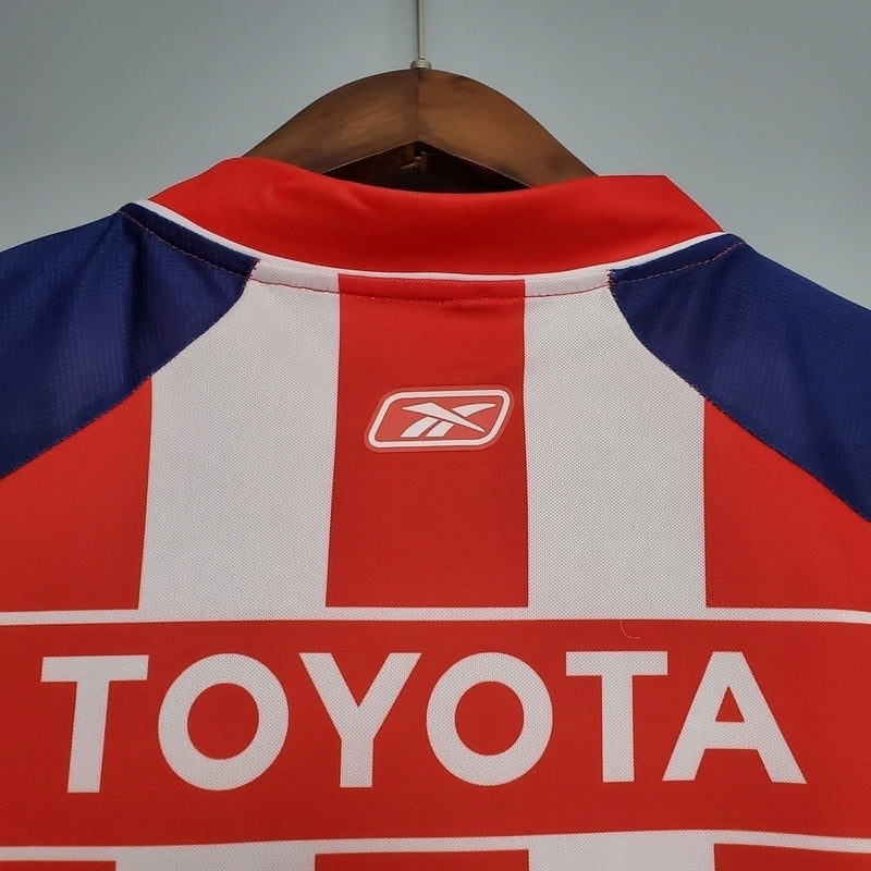 Camisa Chivas Guadalajara Home I 2006/07 Reebok Retrô Masculina Vermelha e Branca, uniforme clássico, escudo bordado, futebol mexicano, retrô colecionável"