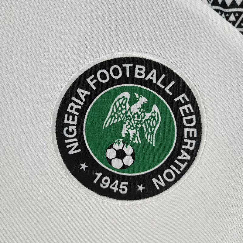 Camisa Nigéria Away II 2022/23 Nike Torcedor Masculina branca – uniforme de futebol seleção nigeriana, modelo away moderno com design da Nike para torcedores e colecionadores."Camisa Nigéria Away 2022/23
Camisa seleção Nigéria branca
Camisa Nigéria Nike 2022
Camisa Nigéria 2022/23 torcedor
Uniforme Nigéria Nike Away
Camisa Nigéria masculina original
Camisa de futebol Nigéria Nike
Camisa Nigéria para colecionador