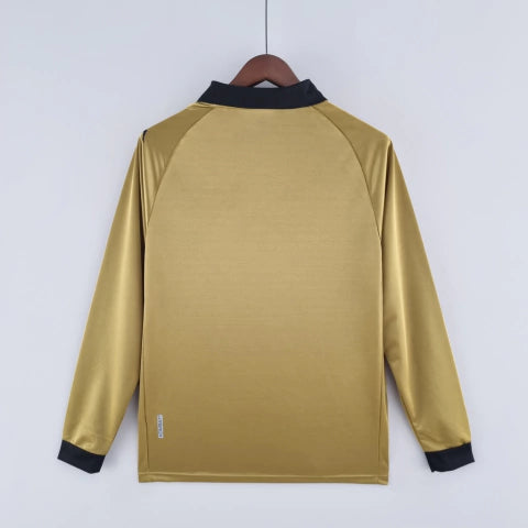 Camisa Venezia Third III 2022/23 Kappa Torcedor Masculina Manga Longa Dourada com detalhes em preto e verde, escudo do clube e design elegante inspirado na moda veneziana.”