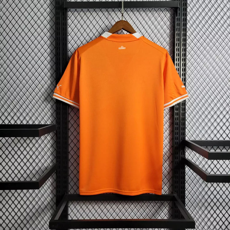 Camisa Costa do Marfim Home I 2022/23 Puma Torcedor Masculina na cor laranja – uniforme oficial dos Elefantes, modelo torcedor, tecido leve e respirável, disponível na Waze Mix."Camisa Costa do Marfim Home 2022
Camisa Costa do Marfim Puma
Camisa Costa do Marfim Laranja
Camisa Elefantes 2022/23
Camisa Costa do Marfim Torcedor Masculina
Uniforme Costa do Marfim Puma
Camisa seleção Costa do Marfim 2022
Camisa oficial Costa do Marfim