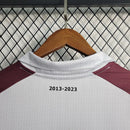 Camisa Torino Especial Suzuki 10 Anos 2023/24 Joma Torcedor Masculina Grená com detalhes dourados e escudo bordado, edição comemorativa da parceria Torino e Suzuki.”