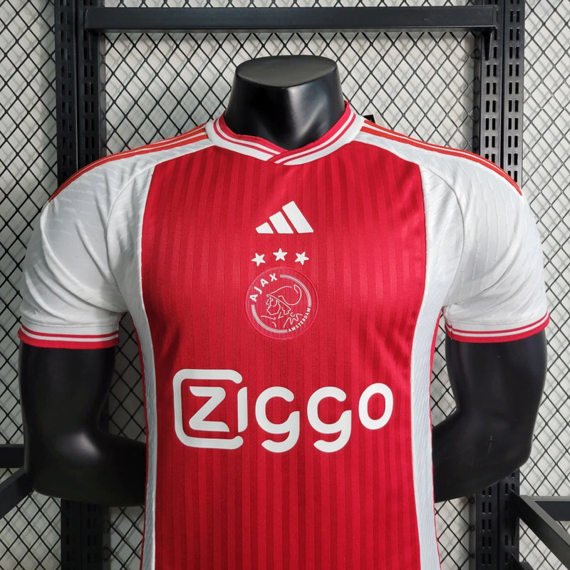 Camisa Ajax Home (1) 2023/24 Adidas Jogador Masculina original, modelo Player Issue branco com faixa vermelha central, tecnologia HEAT.RDY, versão oficial usada pelos atletas."
