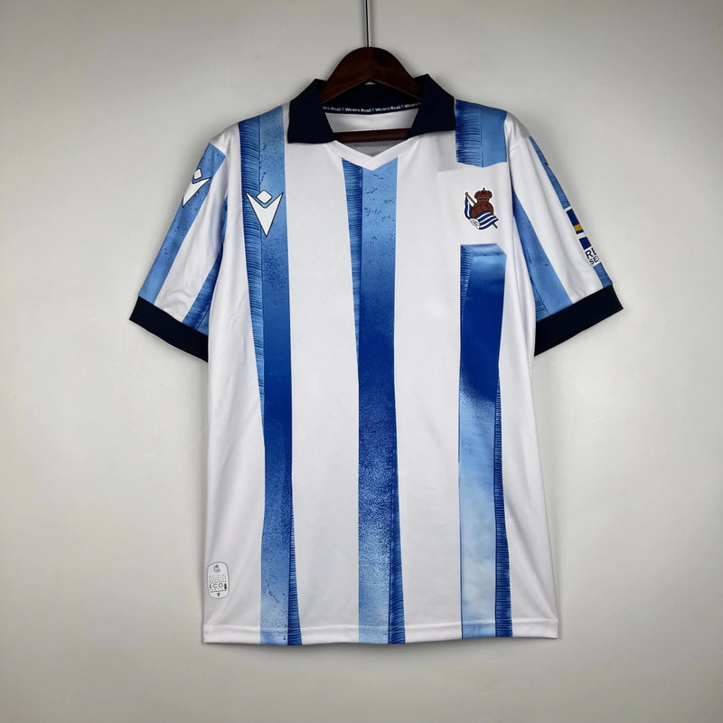 Camisa Real Sociedad Home I 2023/24 Torcedor Masculina - Branca e Azul