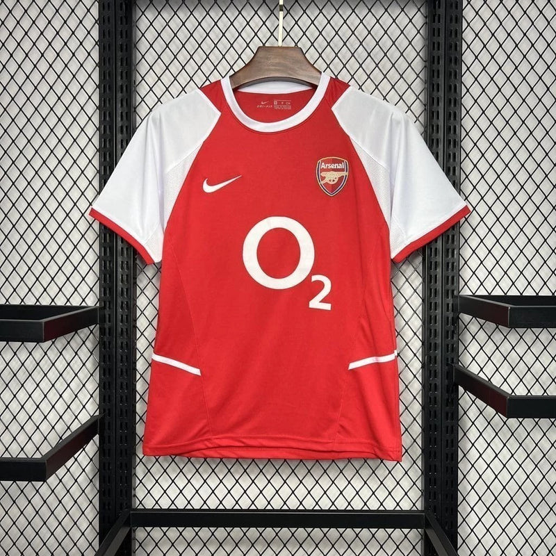 Camisa Arsenal Home I 2002/03 Nike Retrô Masculina, vermelho com mangas brancas, escudo do Arsenal bordado, gola tradicional, ideal para colecionadores e torcedores.