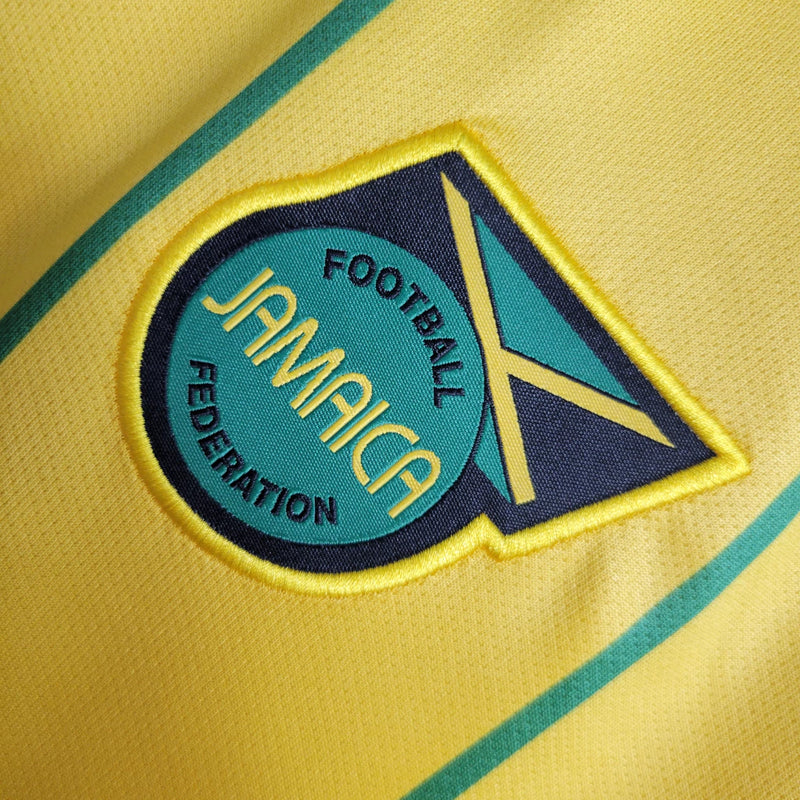 Camisa Jamaica Home I 2023/24 Adidas Torcedor Masculina amarela, uniforme principal da seleção jamaicana, detalhes em verde e preto, tecido leve e respirável, corte masculino."
camisa Jamaica Home 2023/24 amarela
camisa Adidas Jamaica torcedor masculina
uniforme principal seleção Jamaica
camisa Reggae Boyz 2023/24