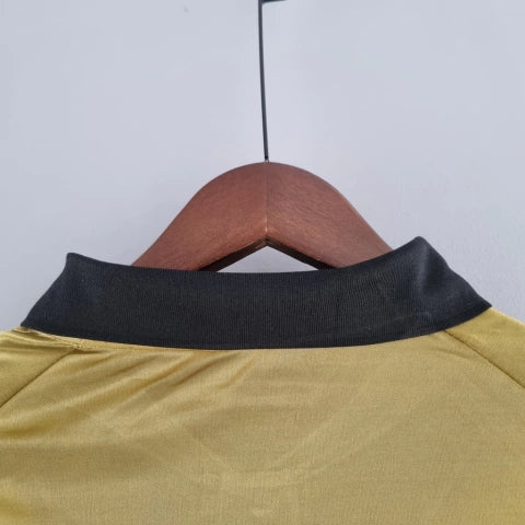 Camisa Venezia Third III 2022/23 Kappa Torcedor Masculina Manga Longa Dourada com detalhes em preto e verde, escudo do clube e design elegante inspirado na moda veneziana.”