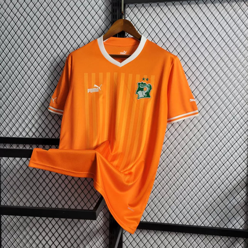 Camisa Costa do Marfim Home I 2022/23 Puma Torcedor Masculina na cor laranja – uniforme oficial dos Elefantes, modelo torcedor, tecido leve e respirável, disponível na Waze Mix."Camisa Costa do Marfim Home 2022
Camisa Costa do Marfim Puma
Camisa Costa do Marfim Laranja
Camisa Elefantes 2022/23
Camisa Costa do Marfim Torcedor Masculina
Uniforme Costa do Marfim Puma
Camisa seleção Costa do Marfim 2022
Camisa oficial Costa do Marfim