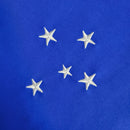 Kit Infantil Cruzeiro Home 2023/24 Adidas azul celeste com camisa e short oficial, escudo bordado e design confortável para crianças torcedoras.